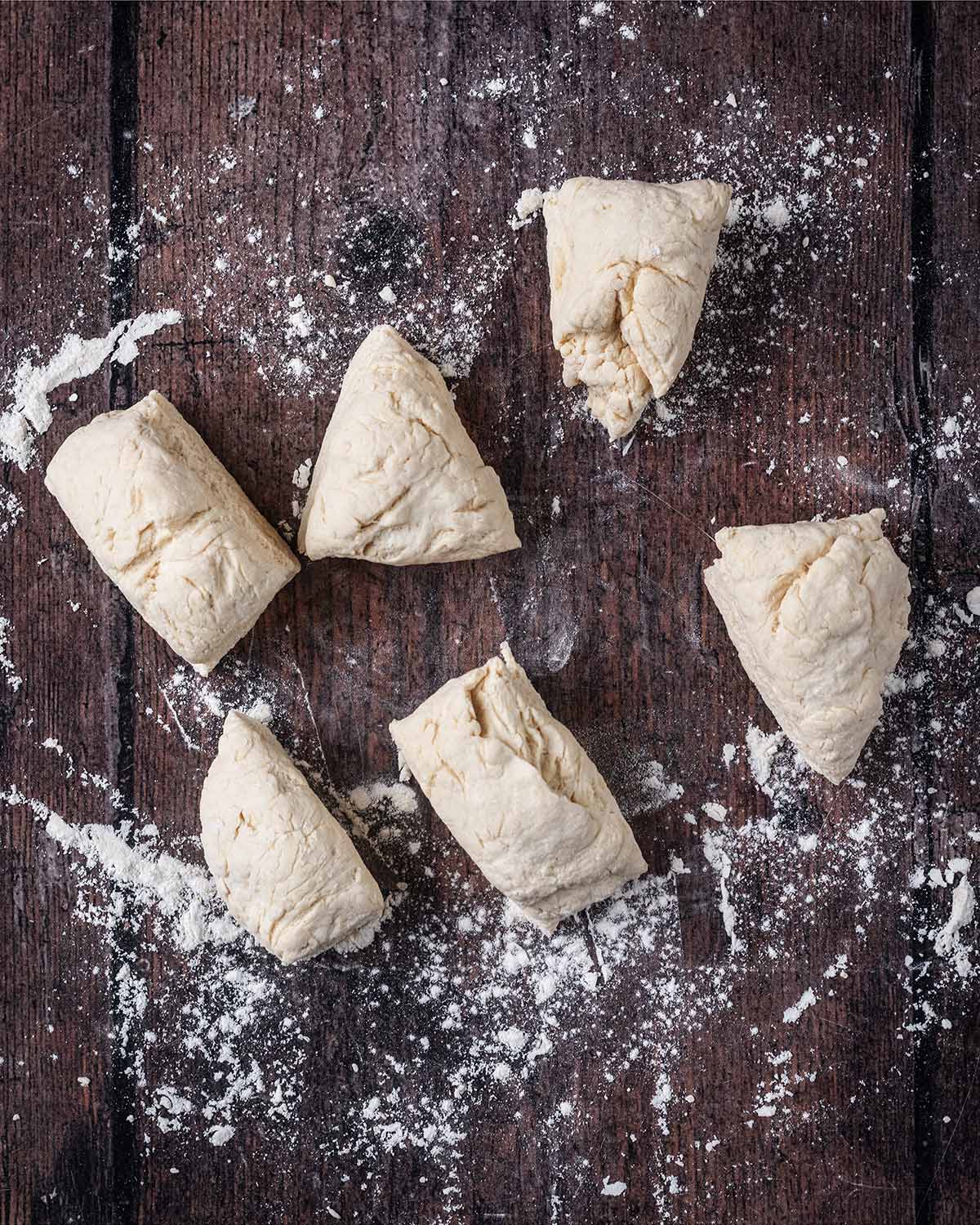 The ball of dough cut into six equal pieces.