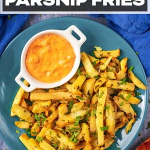 A plate of baked parsnip fries with a title text overlay.