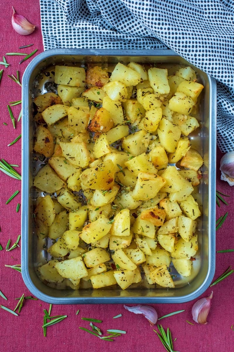 A roasting tin containing Roasted Potatoes.