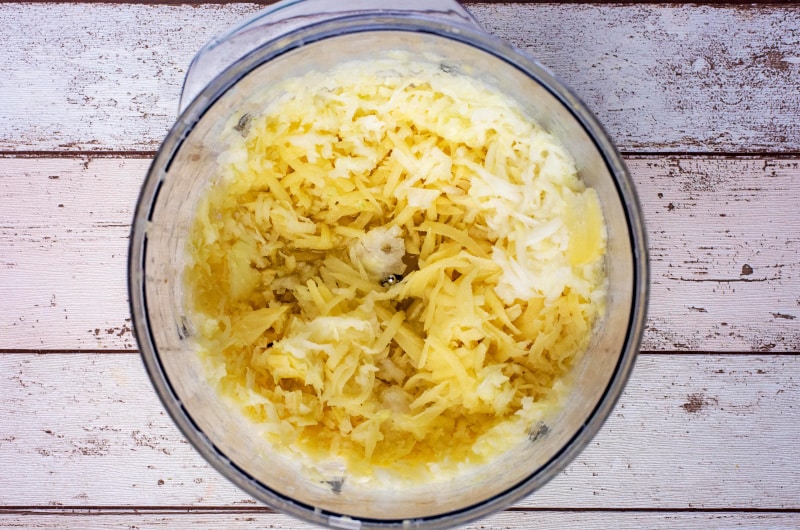 Grated potato and onion in a food processor.