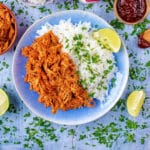 Slow Cooker BBQ Chicken and rice on a blue plate.
