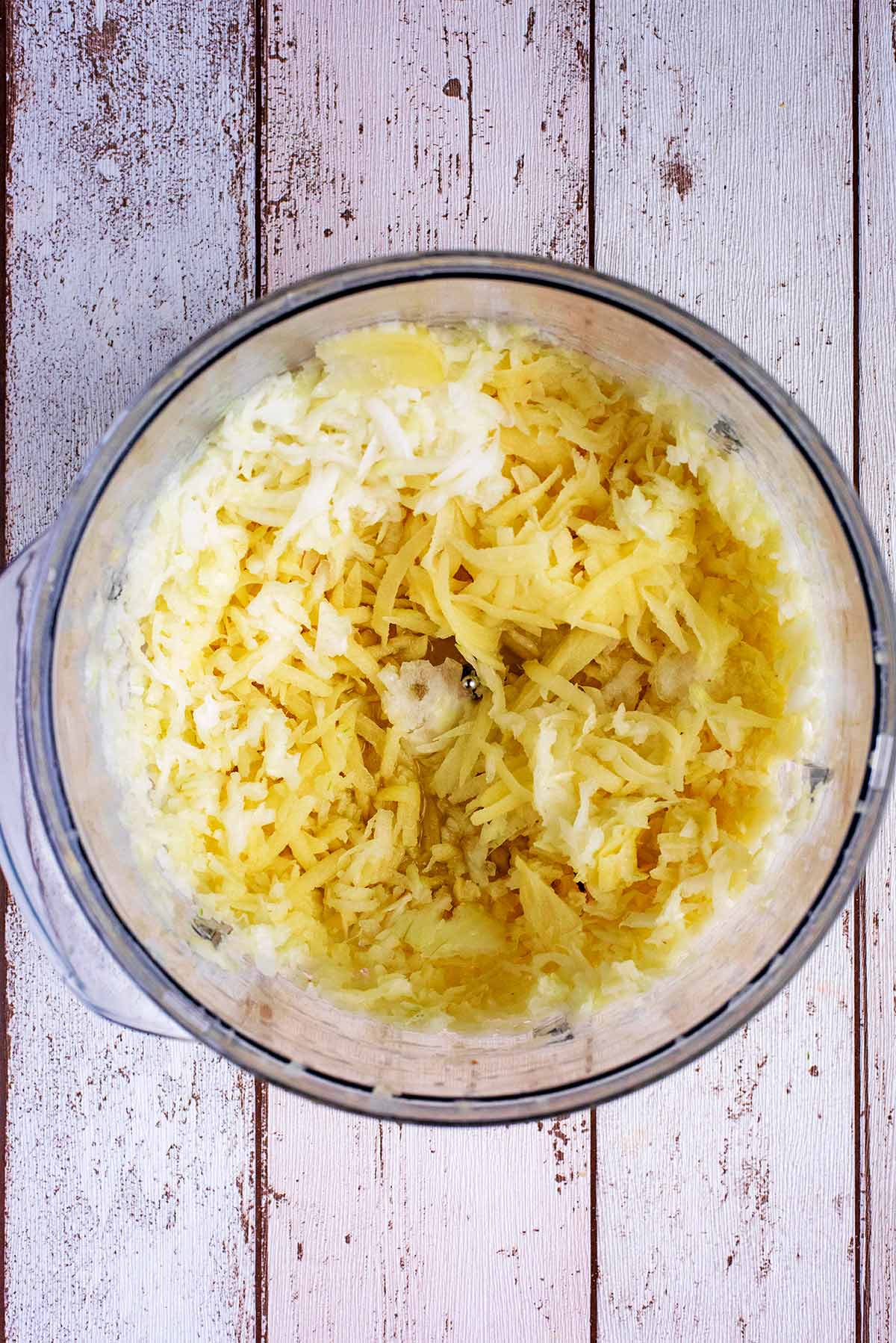 Grated potato and onion in a food processor.