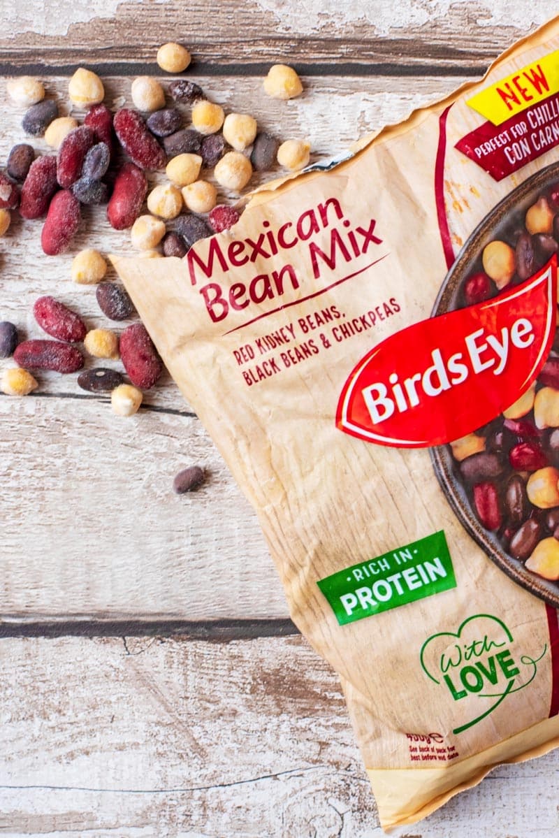 An open bag of Birdseye Mexican Bean Mix with contents spilled out.