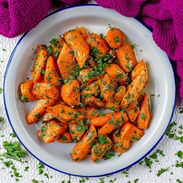 Garlic and Parsley Roasted Carrots in a white bowl.