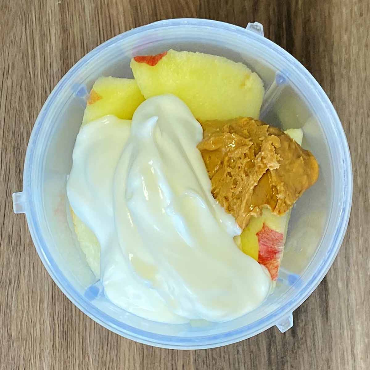 Nut butter and yogurt added to the blender.