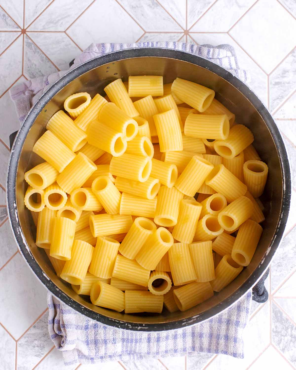 Rigatoni pasta in a saucepan.