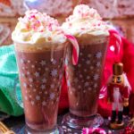Two latte glasses filled with peppermint hot chocolate.
