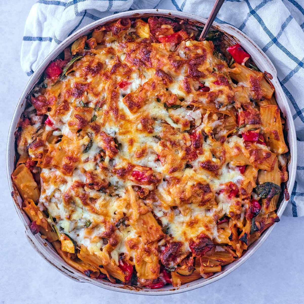Cooked pasta bake in a large baking dish.