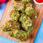 Cheese Bakes Broccoli Bites on a wooden board.