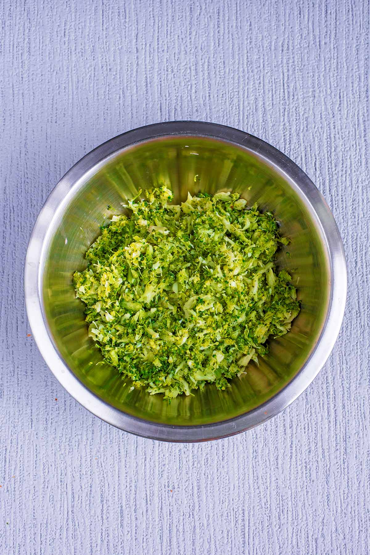 A bowl of mashed broccoli.