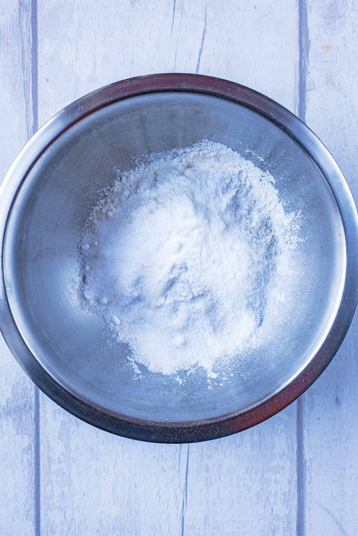 Flour, sugar and baking powder in a large mixing bowl.