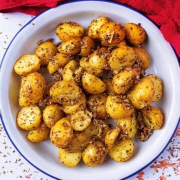 Roasted Parmesan Potatoes in a metal serving dish.