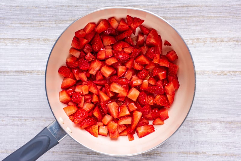 chopped strawberries in a saucepan.