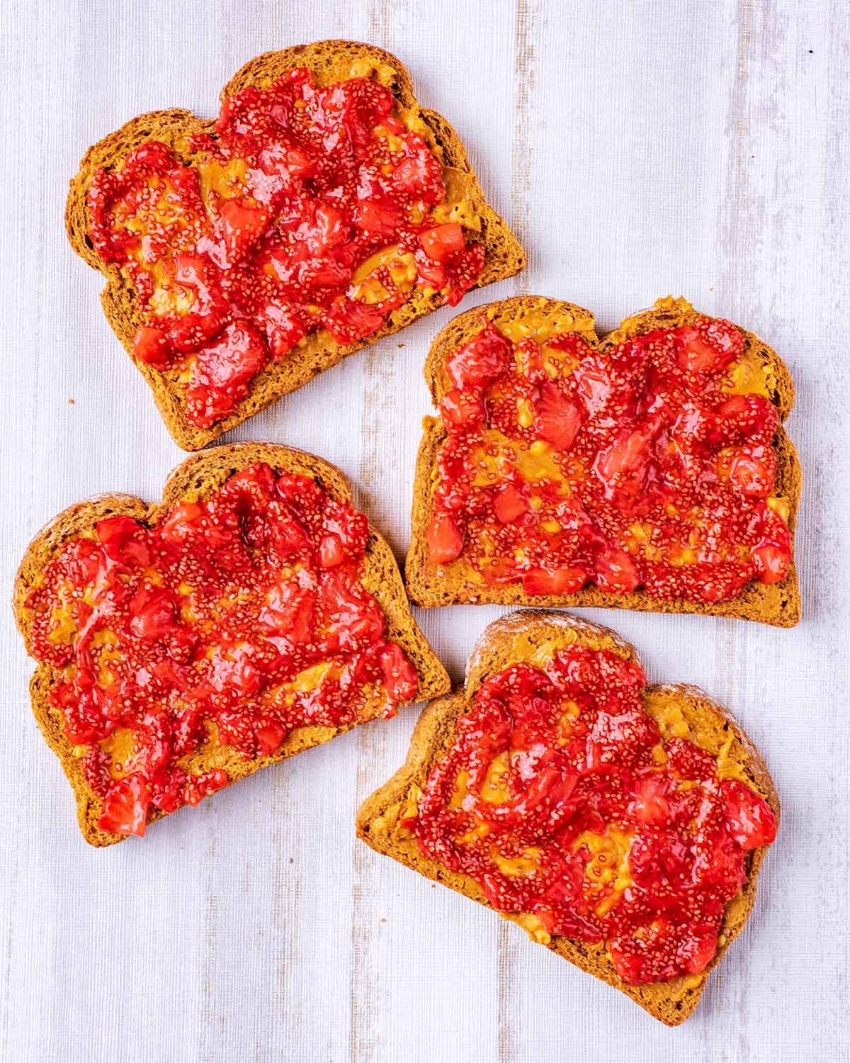 Strawberry jam spread over all of the peanut butter.