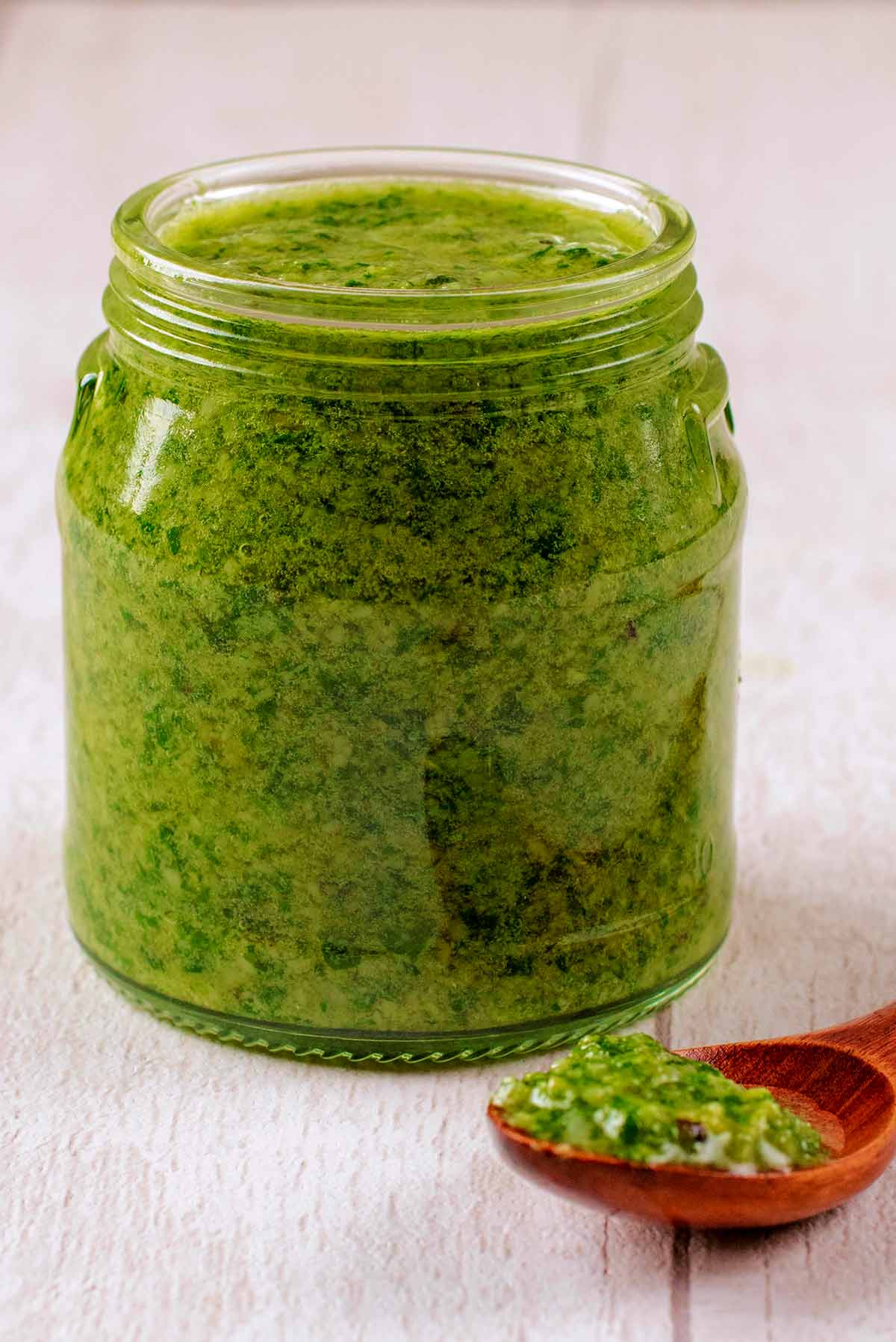 A jar of green herb Pesto.
