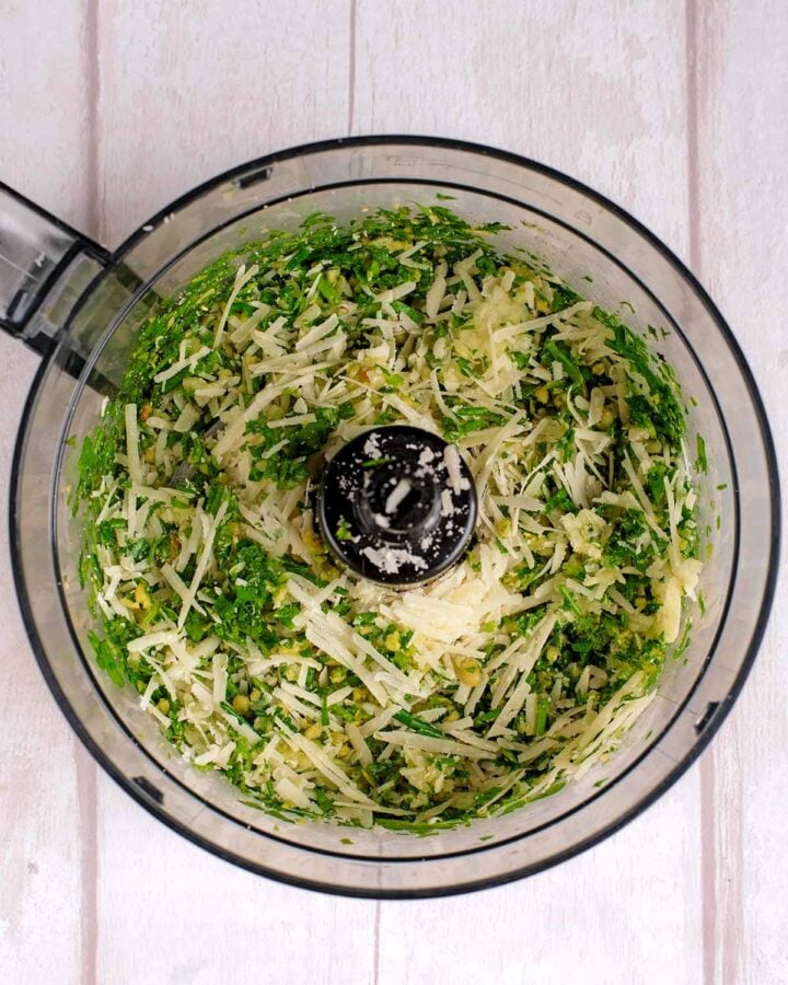 Grated Parmesan added to the food processor.