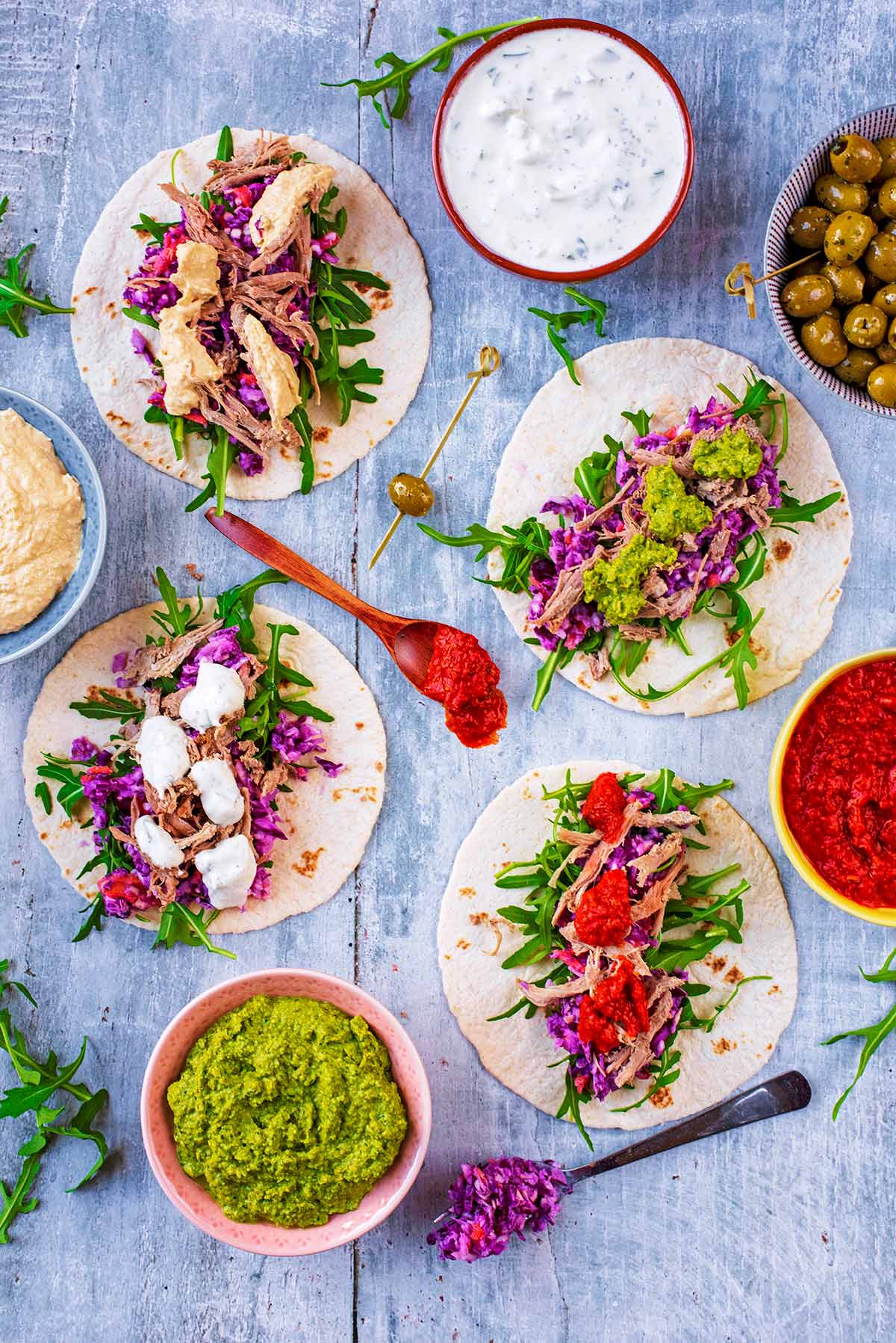 Four small wraps each topped with Pulled Lamb and a selection of sauces.