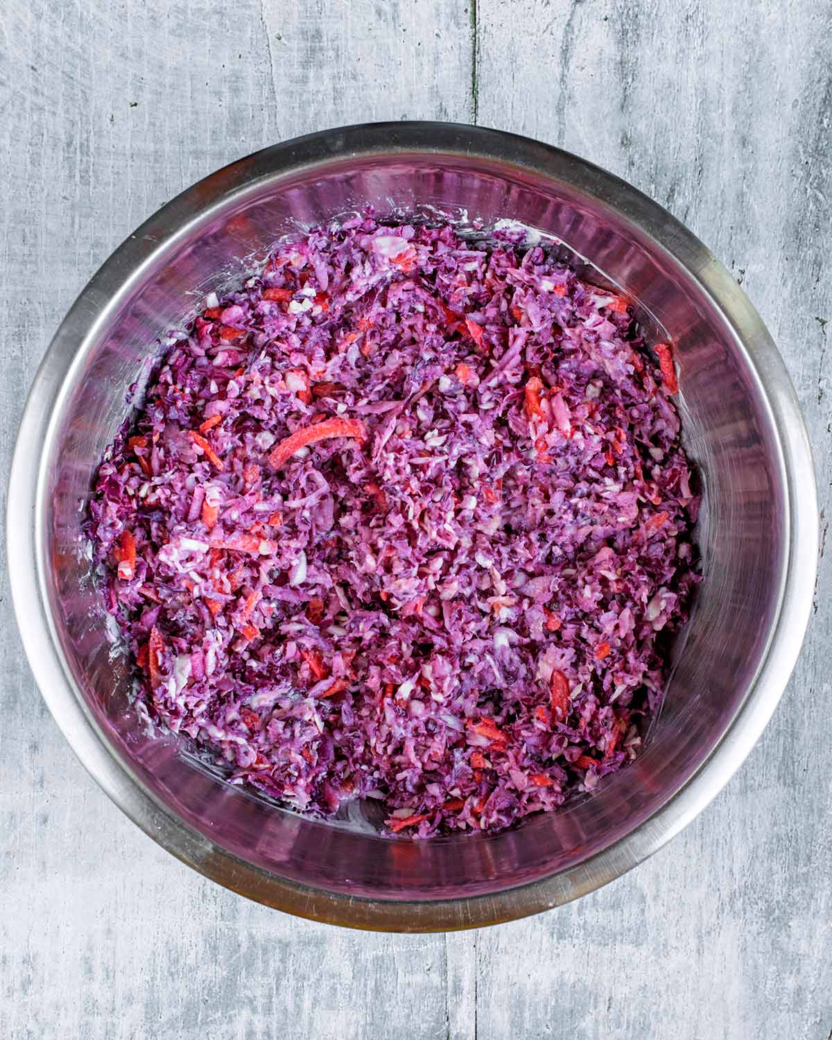 A large bowl of purple coloured slaw.