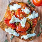 Roasted Cherry Tomatoes and mozzarella on toasted bread.