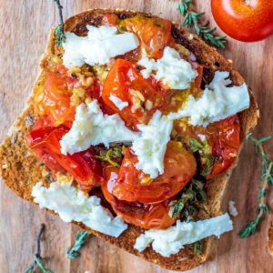 Roasted Cherry Tomatoes and mozzarella on toasted bread.