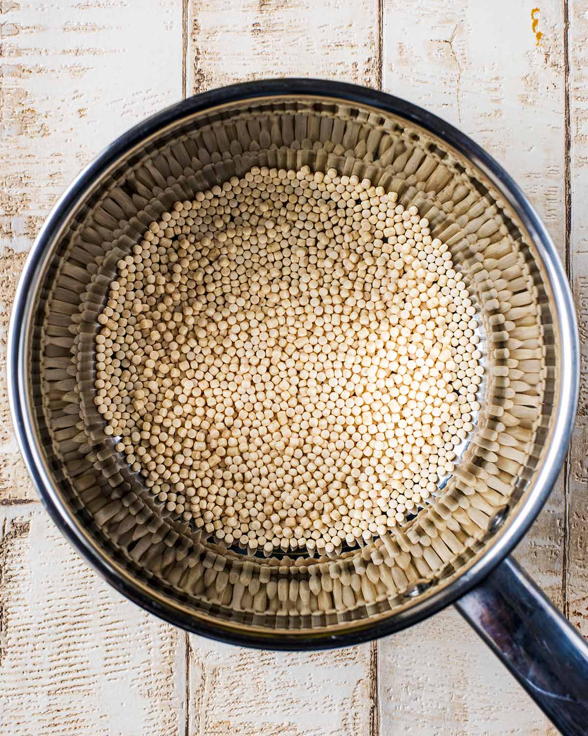 A saucepan containing couscous.