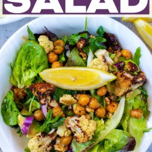 A bowl of cauliflower salad with a text title overlay.