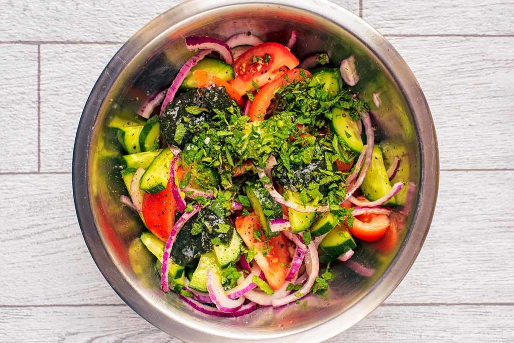 Mint sauce and mint leaves added to the bowl.