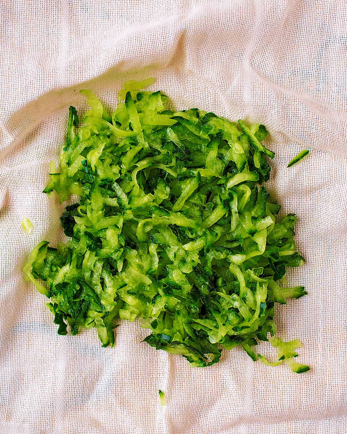 Grated cucumber on a muslin cloth.