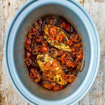 Slow cooker balsamic chicken in a slow cooker pot.