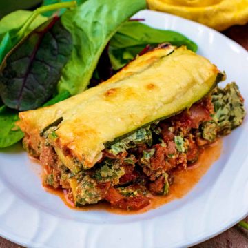 Low carb lasagna on a plate with salad.