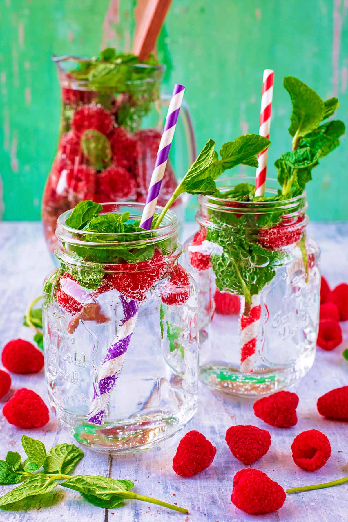 Raspberry and Mint Sparkling Water in two mason glasses.