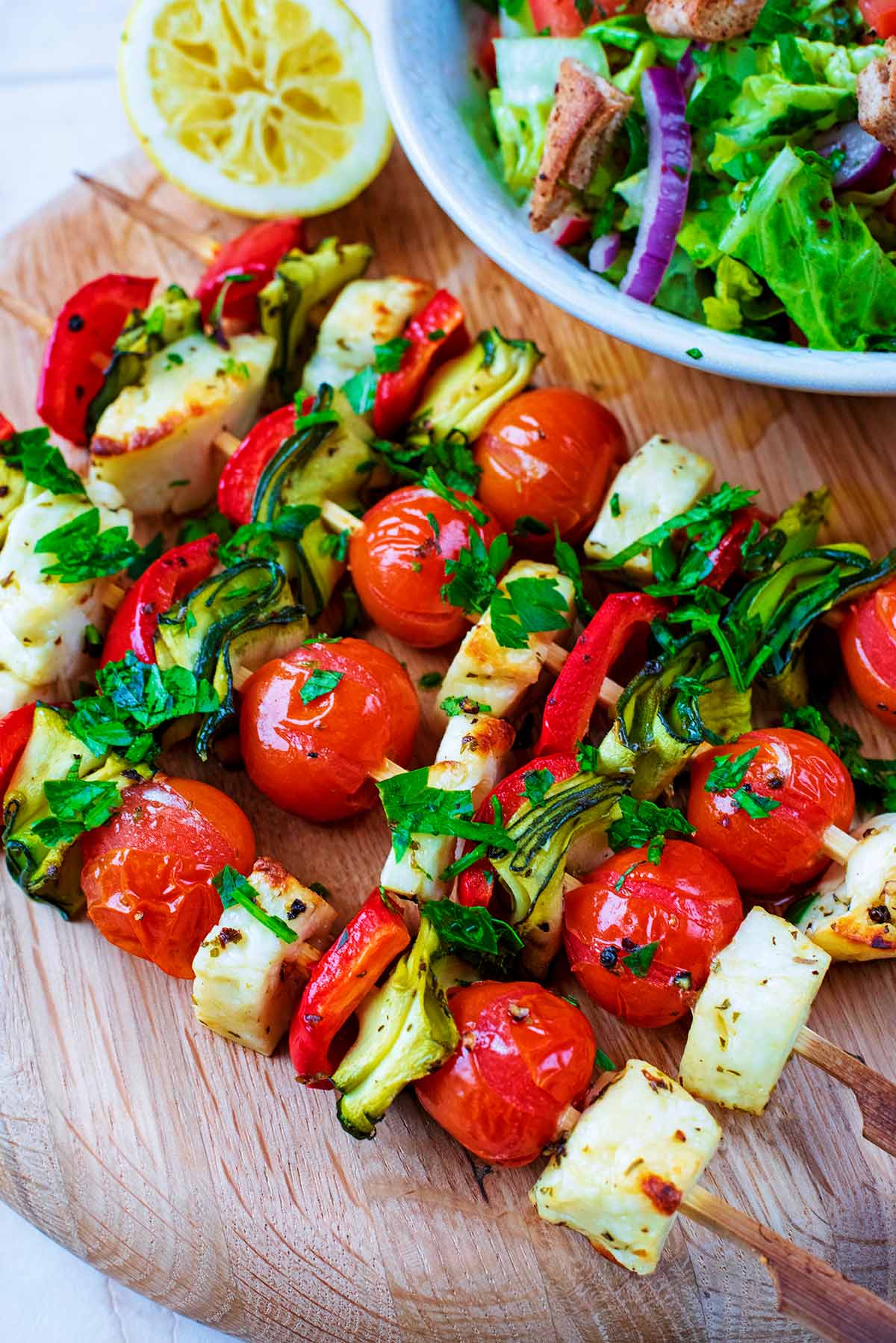 Vegetable and Halloumi Kebabs on a circular serving board.
