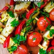 Vegetable and halloumi skewers with a text overlay title.