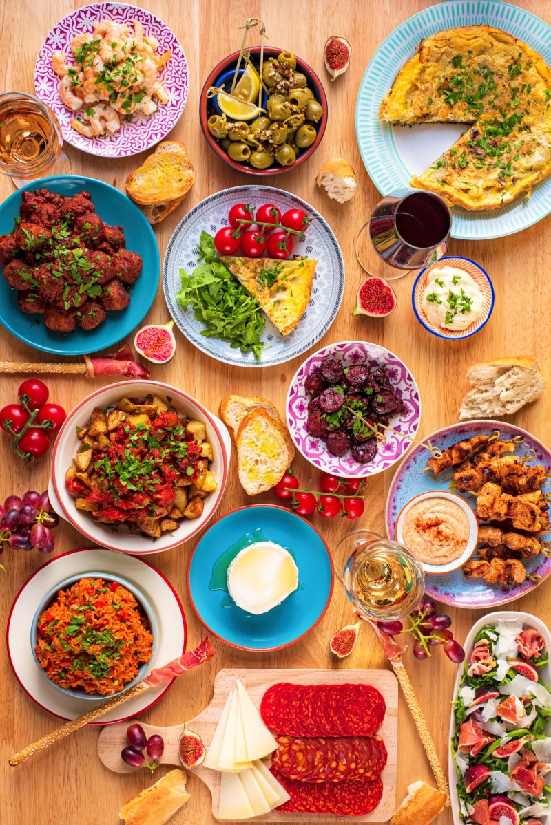 A table covered in various tapas dishes.