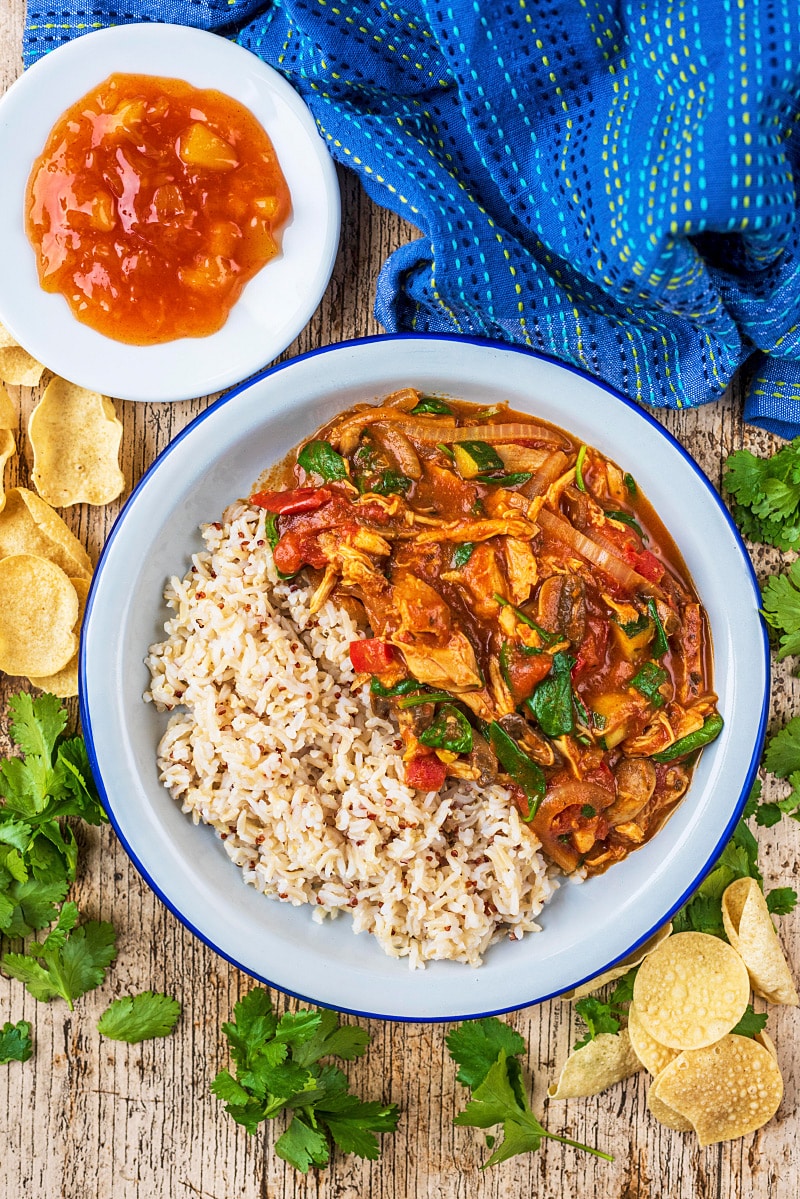 Leftover Turkey Curry with rice in a round white dish.