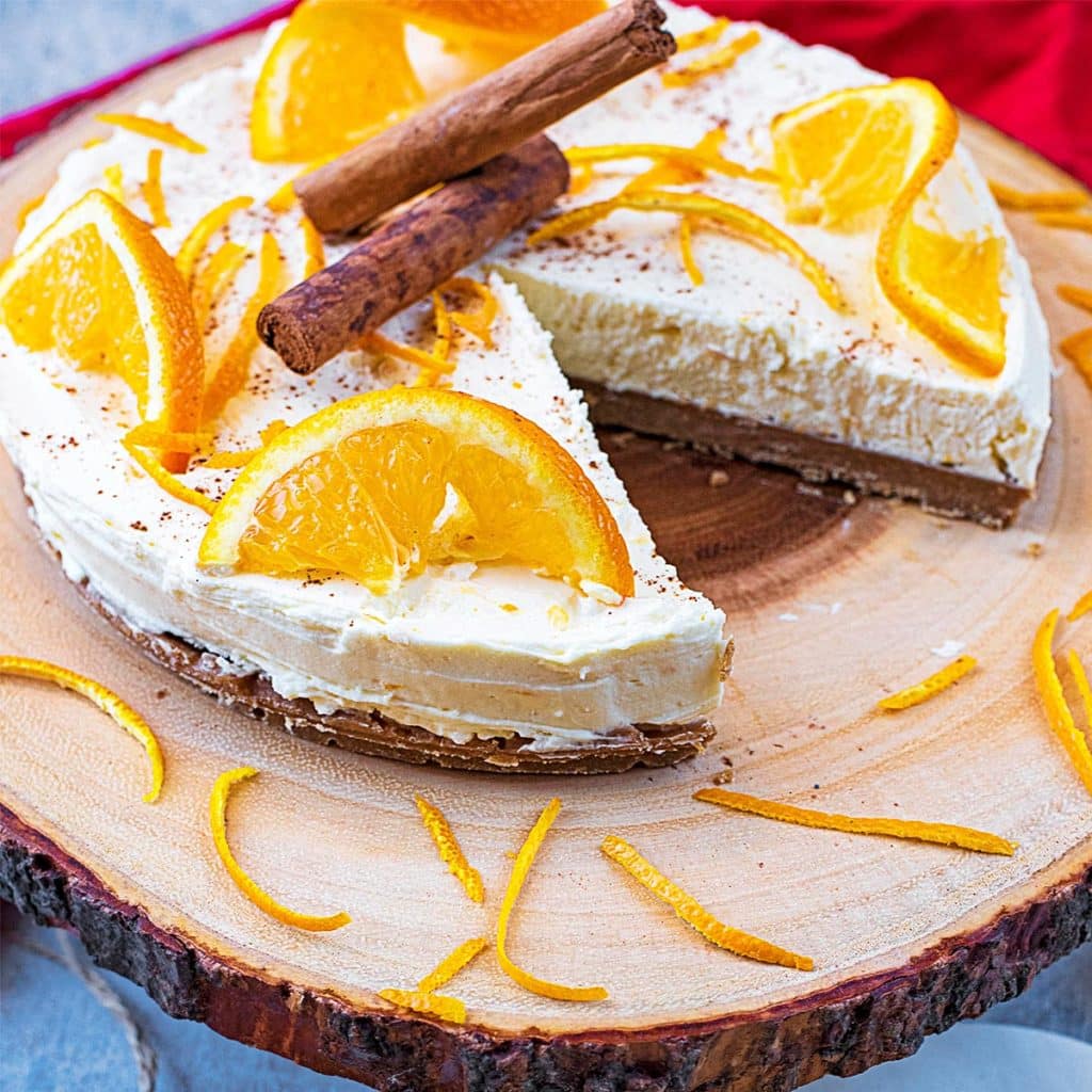 Christmas cheesecake with a slice cut out.