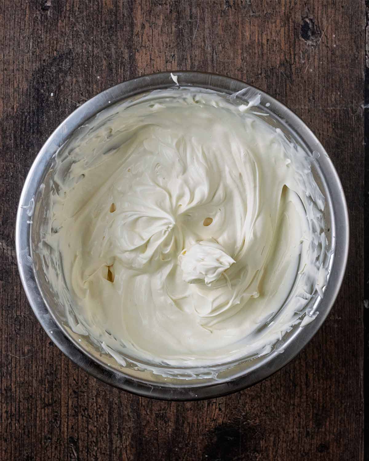 Whipped cream in a mixing bowl.