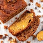 Healthy Banana Bread loaf with slices of bread and peanut butter.
