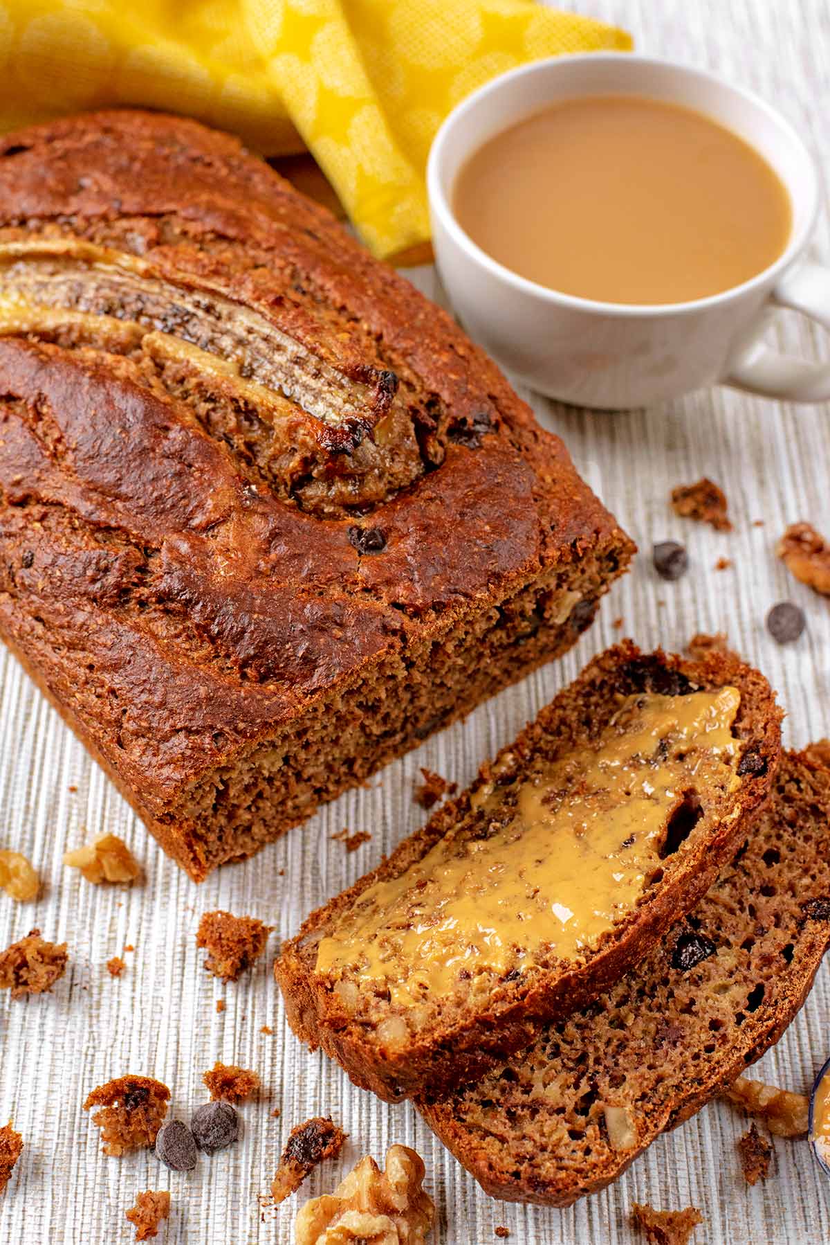 A loaf of banana bread with some slices cut off.