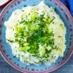 The best creamy mashed potatoes with chopped herbs and spring onions.