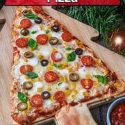Christmas tree pizza with a text overlay title.