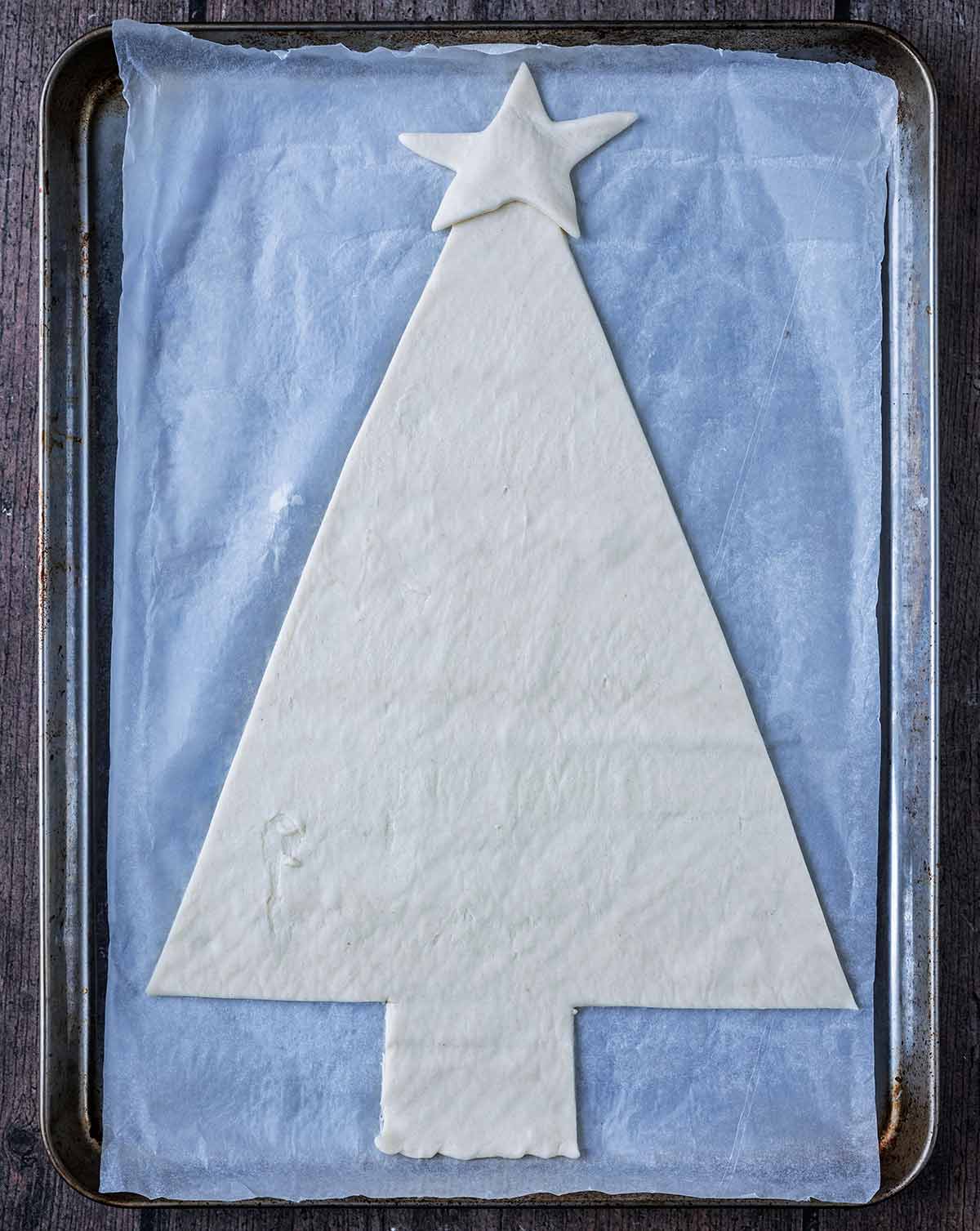 Pizza dough cut into a tree shape.