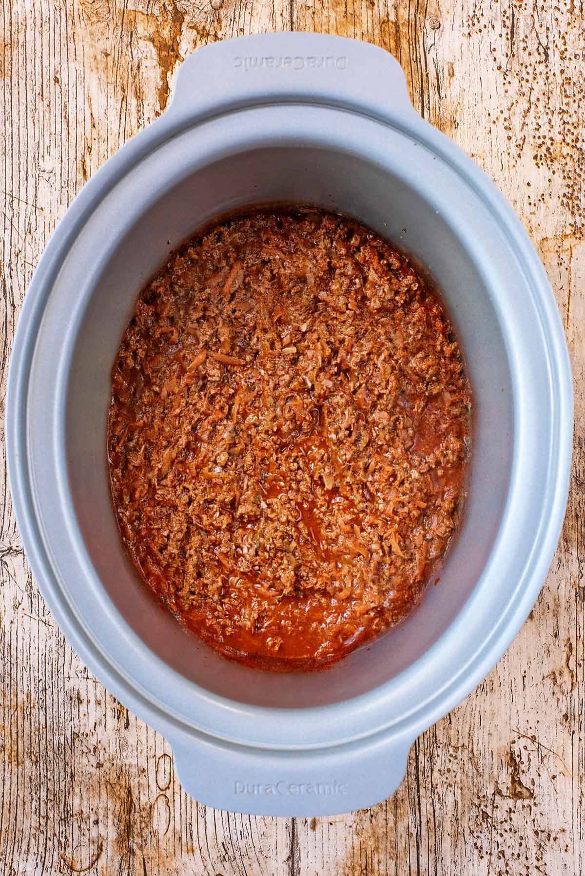 Cooked bolognese in the slow cooker bowl.