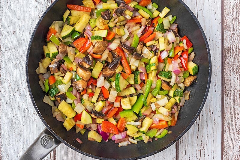 A frying pan full of chopped vegetables