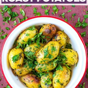 Four Herb Roast Potatoes in a bowl with a text title ovelay.