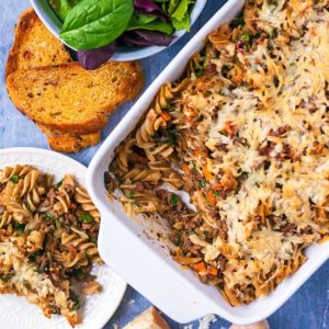 Bolognese Pasta Bake on a plate and in a baking dish.