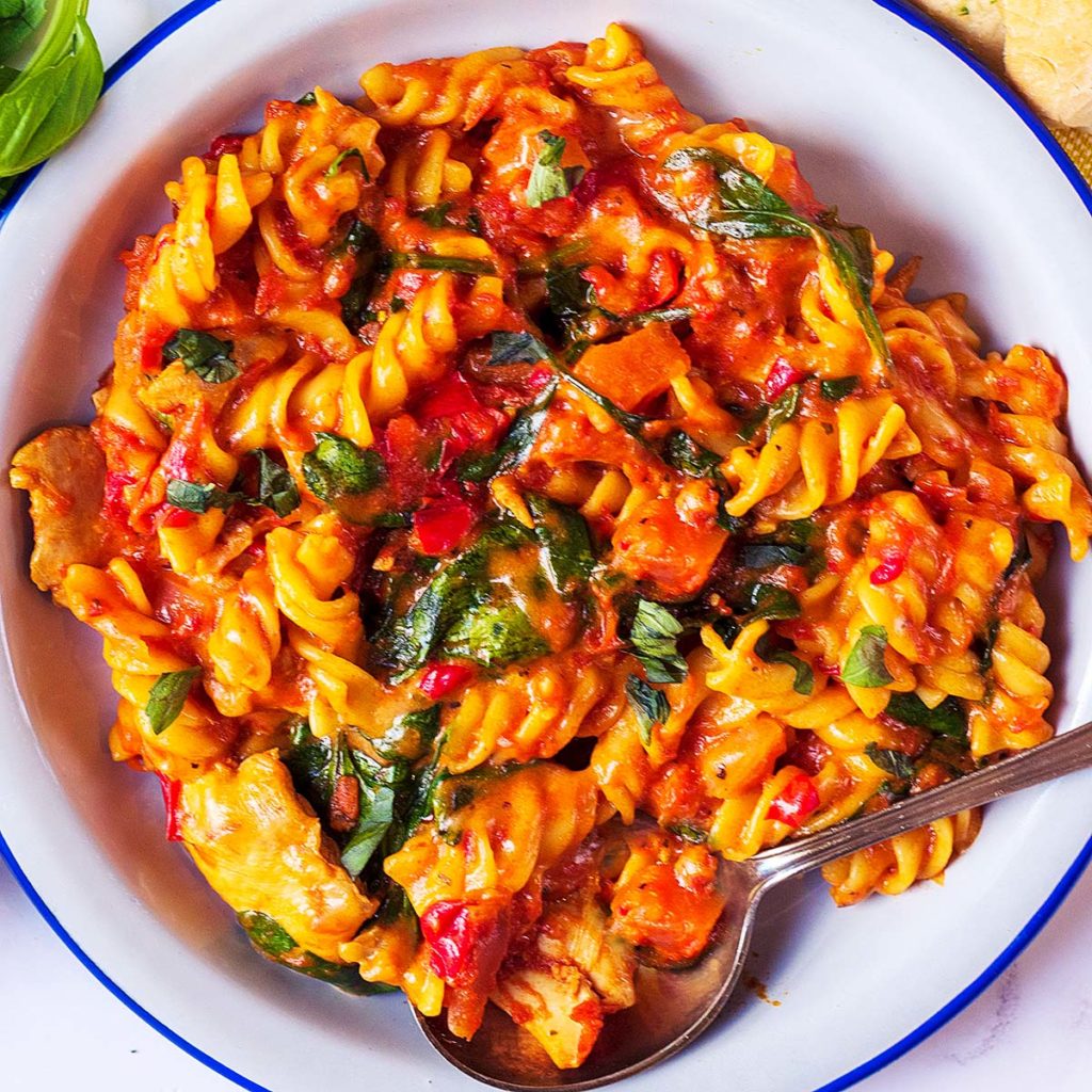 Instant pot chicken pasta on a white plate.