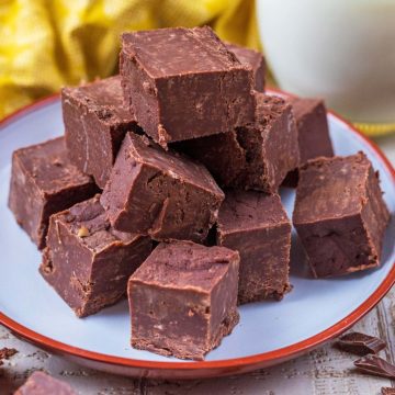A plate of cubes of chocolate fudge.
