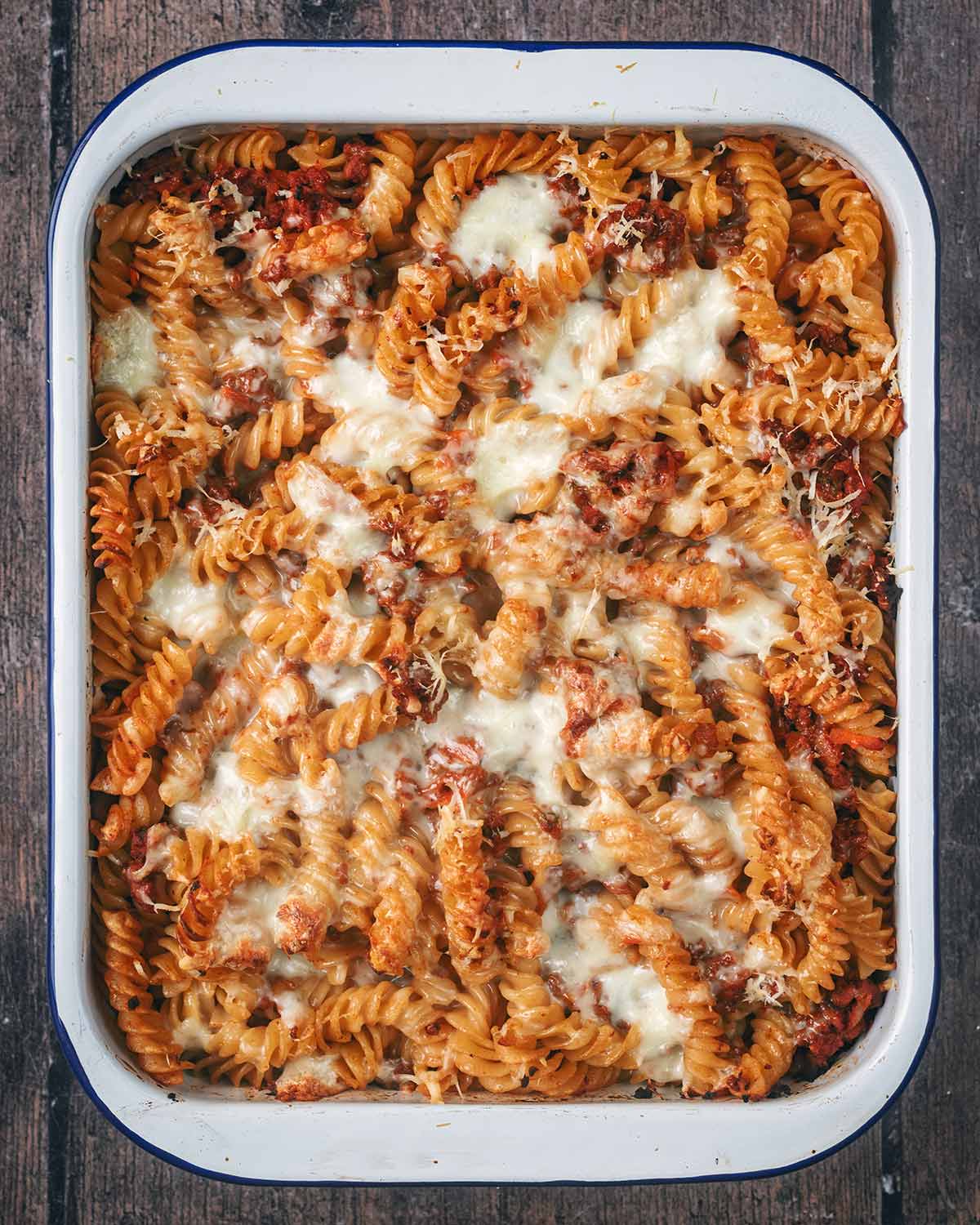 Cooked pasta bake with a melted cheese top.