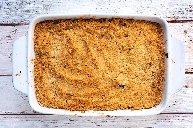 A crumble in a baking dish with a golden brown top.